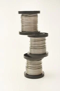 Coils with solder. Plastic coils with tin-lead solder. Materials for electr.. Stock Photos