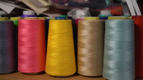 Coils with thread stand on the shelf. Video stock 90550212