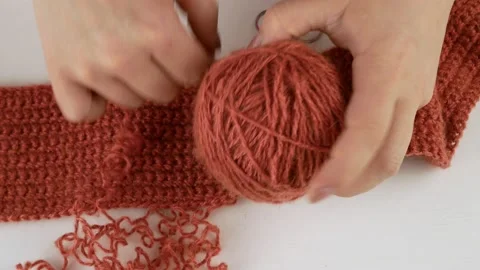 Coils the threads into a ball.Craft and sewing clothes with your own hands. Stock Footage 141178332