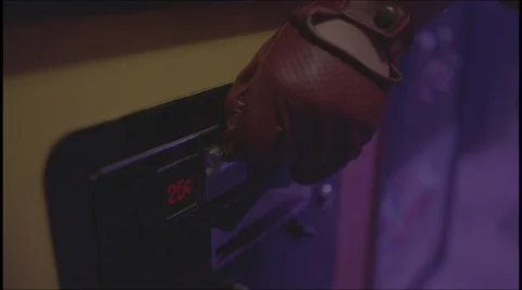 Coin being inserted into arcade machine Stock Footage 118928879