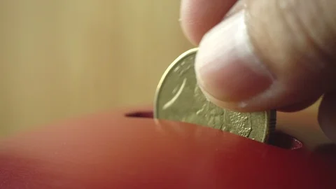 Coin being inserted into a vintage donation box, close-up, 4k Stock-Footage 89191360