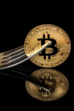 Coin bitcoin with fork Stock Photos