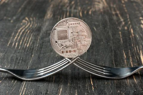 Coin bitcoin with fork Stock Photos