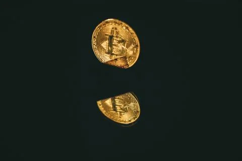 Coin bitcoin with reflection in the mirror Stock Photos