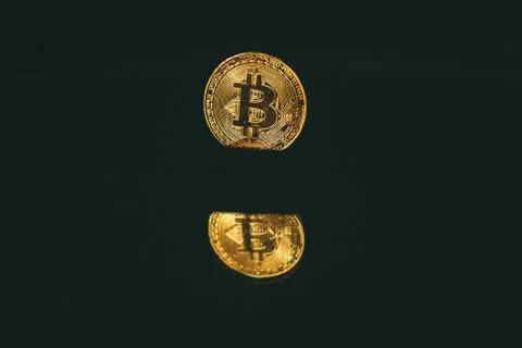 Coin bitcoin with reflection in the mirror Stock Photos