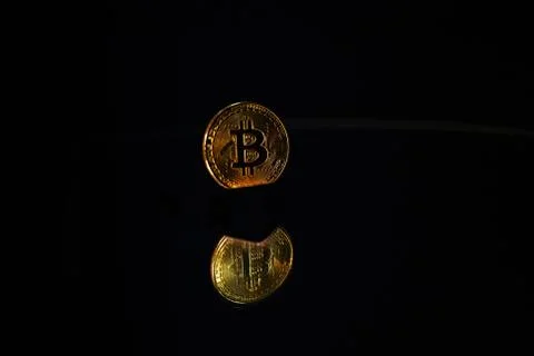 Coin bitcoin with reflection in the mirror Stock Photos