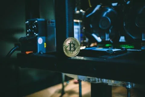 Coin bitcoin on the system unit Stock Photos