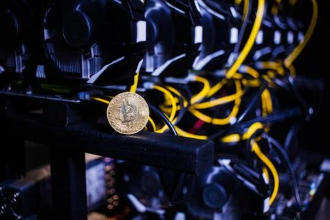 Coin bitcoin on the system unit Stock Photos