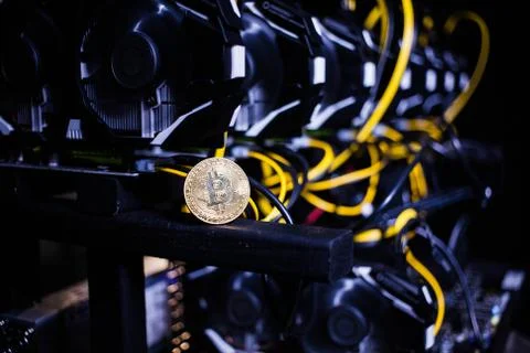 Coin bitcoin on the system unit Stock Photos