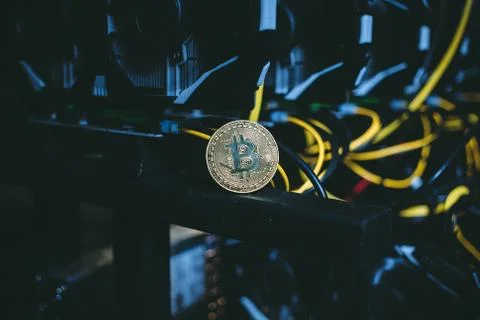 Coin bitcoin on the system unit Stock Photos