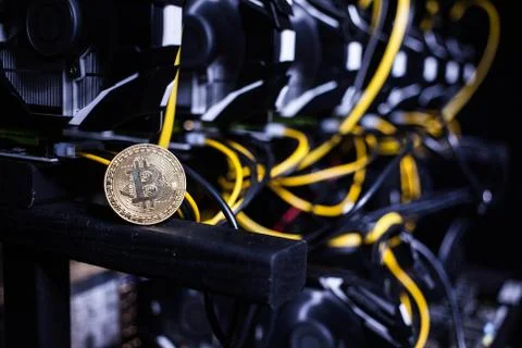 Coin bitcoin on the system unit Stock Photos