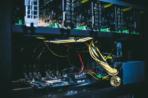 Coin bitcoin on the system unit Stock Photos