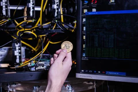 Coin bitcoin on the system unit Stock Photos