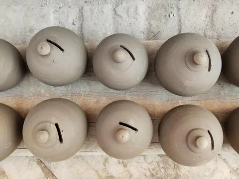 Coin box called Gullak drying in sunlight, Indian village life, clay business Stock Photos
