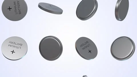 Coin Cells Falling on a Light Blue Background. Lithium Batteries 3D Animation. 4 Video stock 297677129