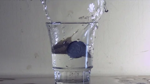 Coin Fall Into The Water Slowmotion 2.000 fps Stock Footage 93779414