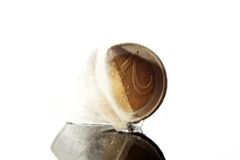 Coin in ice cube Stock Photos