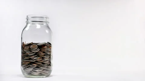 Coin in jar increasing - stop motion. Stock Footage 141974005