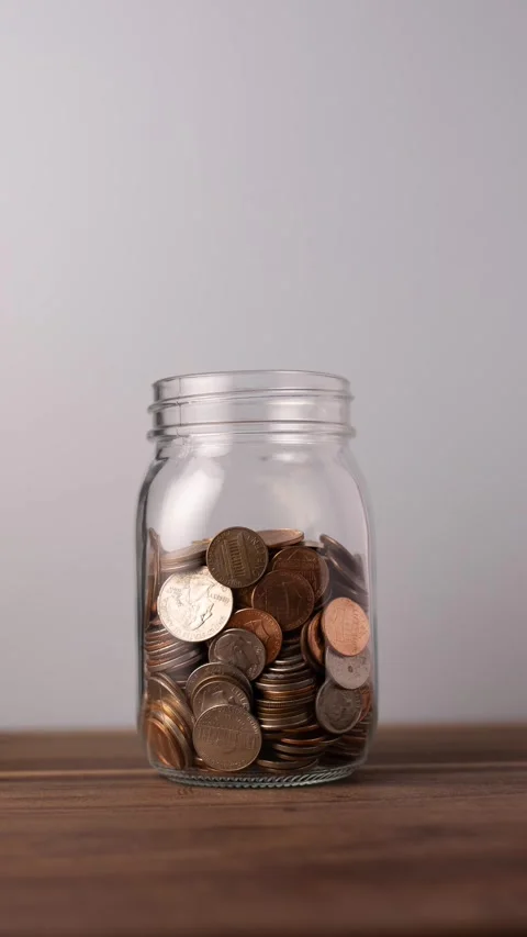 Coin Jar Timelapse Vertical Stock Footage 332310510