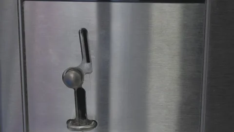 Coin Machine Dropping Quarters On Washing Machine At The Laundromat  Stock Footage 310280526