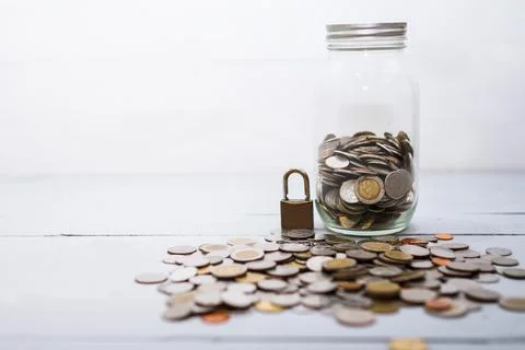 Coin money stack and lock with space for text background. Saving and financia Stock Photos