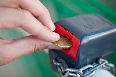 Coin to open lock Stock Photos