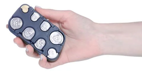 Coin plastic holder in hand Stock Photos