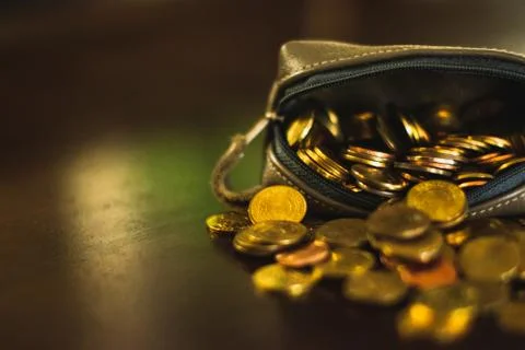 Coin purse falling Stock Photos