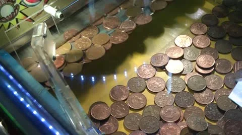 Coin push machine in amusement arcade 2p coins Stock Footage 12554326