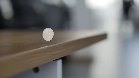 The Coin Rolls and Falls from the Table Video stock 91737610