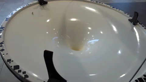 The coin rolls into the funnel Stock Footage 89938754