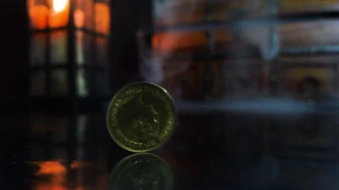 Coin Spinning against historical backdrop in slow motion with Chest and Smoke Stock Footage 333609806