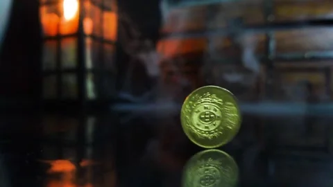 Coin Spinning against historical background Stock Footage 333609510