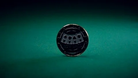 Coin Spinning on a Game Table Stock-Footage 70637738