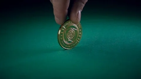 Coin Spinning on a Game Table Stock-Footage 70637800