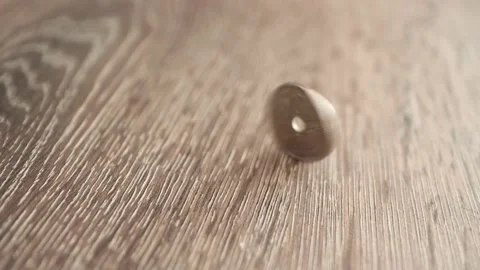 Coin Spinning On The Table Stock Footage 139525492