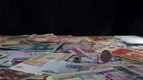 The coin is spinning on a table Video stock 234177312