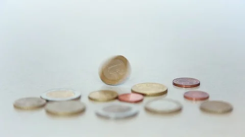 The coin spins and falls on the table Stock Footage 111918562