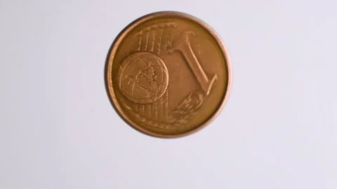 The coin spins on a white background and stops. to cast lots. Stock Footage 200485218
