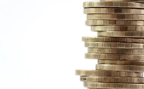 Coin stack, close-up on white background  (select focus) Stock Photos