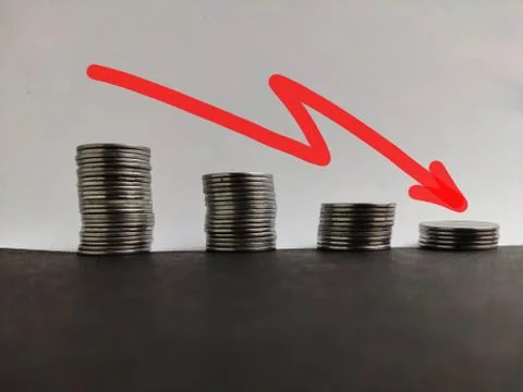 Coin stack step down graph with red arrow, Risk management business financial 写真素材