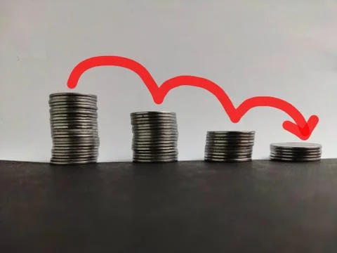 Coin stack step down graph with red arrow, Risk management business financial Stock Photos