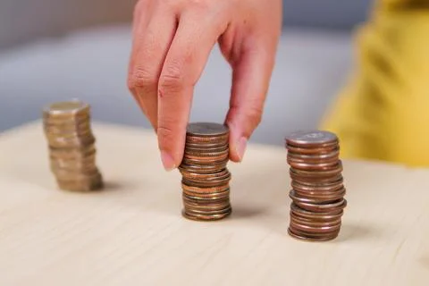 Coin stacking challenge home tutorial indoor close-up money management concep Photos