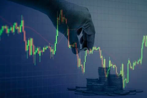Coin stacks with hand candlestick graph background , Business and financial c Stock Photos