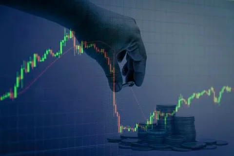 Coin stacks with hand candlestick graph background , Business and financial c Stock Photos