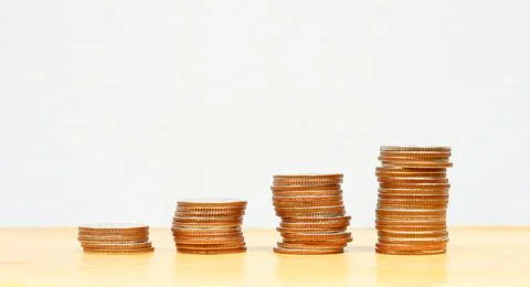 Coin stacks on a white background Stock Photos