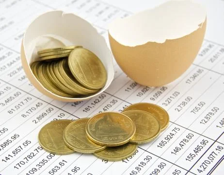 Coin of thailand in egg shell on statement Stock Photos