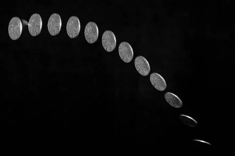 Coin toss Stroboscopic effect created using flash capturing the motion of ... Stock Photos