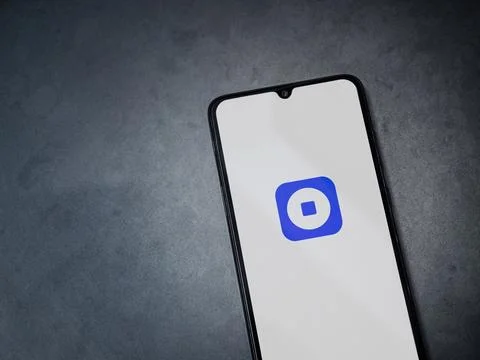 Coinbase Wallet app launch screen on smartphone on dark marble stone backgrou Stock Photos