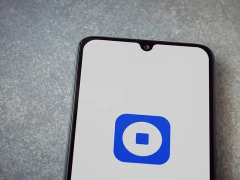 Coinbase Wallet app launch screen on smartphone on ceramic stone background Stock Photos